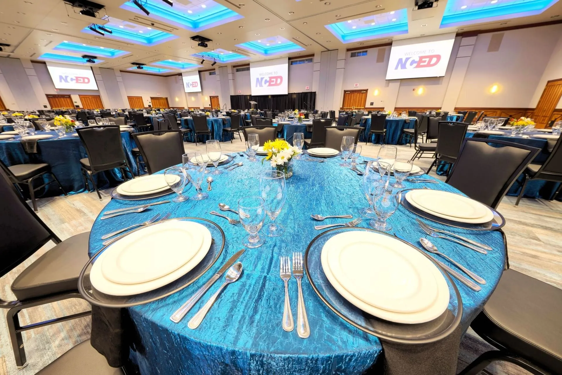 Elegantly set corporate gala ballroom ready for guests