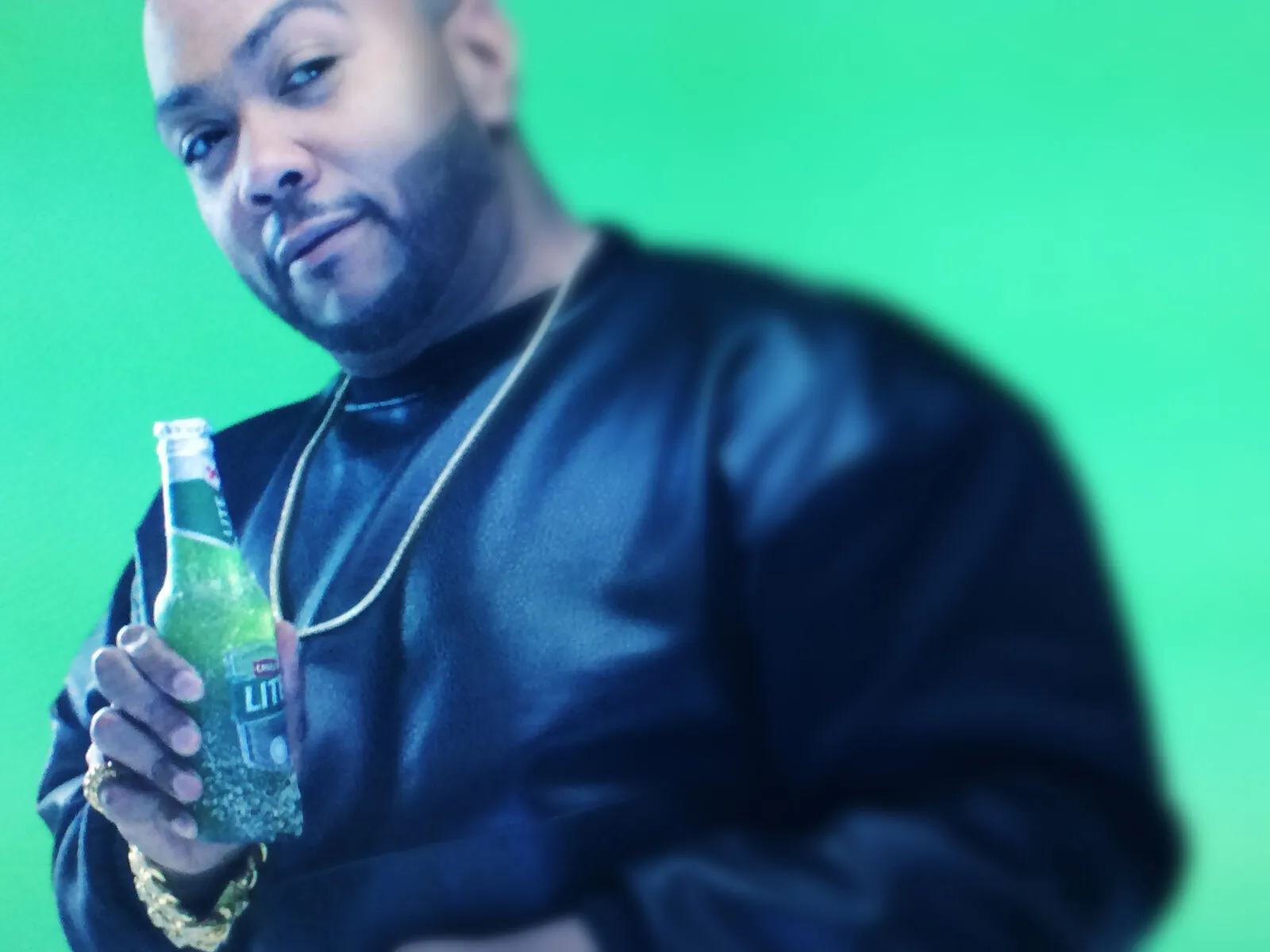 Brand ambassador holding a Castle Lite bottle at a B&W Productions activation