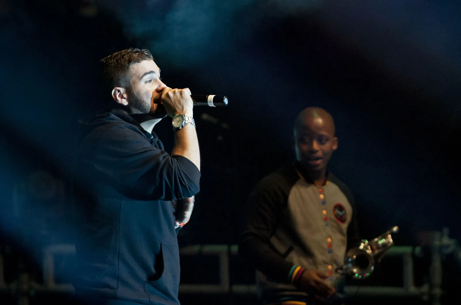 Live event MC and saxophonist performing on a B&W Productions stage