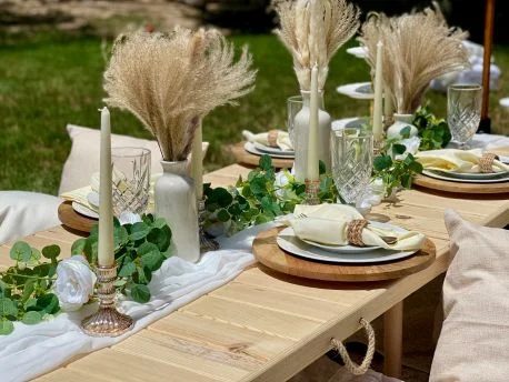 A boho garden kitchen tea setup with pampas grass and soft neutral tones