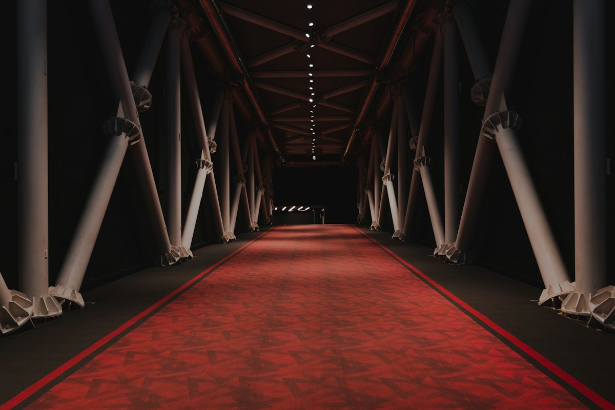 Old Hollywood theme: a red carpet down a dramatically lit walkway