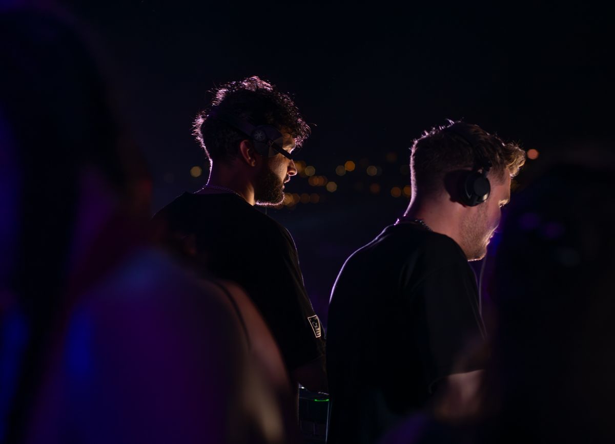 Silent Disco Rooftop theme: a night-time crowd wearing headphones