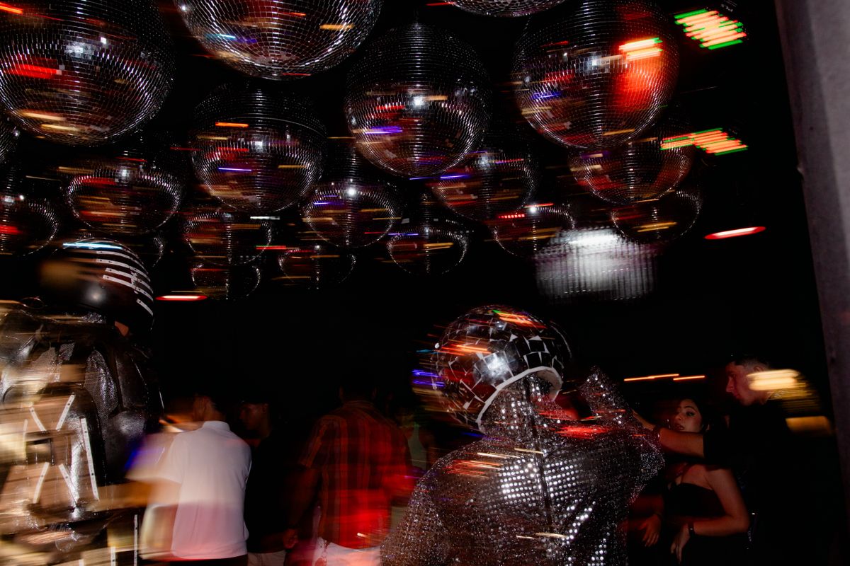 Studio 54 disco theme: a mirror-ball ceiling over a dance floor
