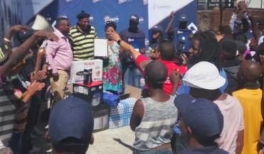 Promoters running a tavern activation with a crowd of consumers