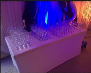 Outdoor corporate hospitality setup with branded lounge furniture