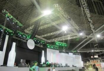 Interior of a large production stage with lighting and screens