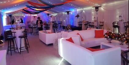 Draped ceiling and lounge area styled for a premium event