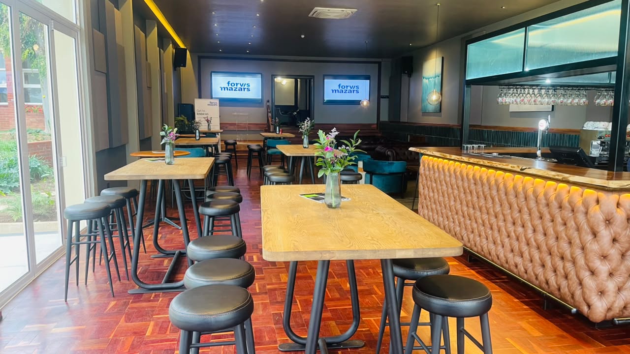 Grand Lounge bar area with screens