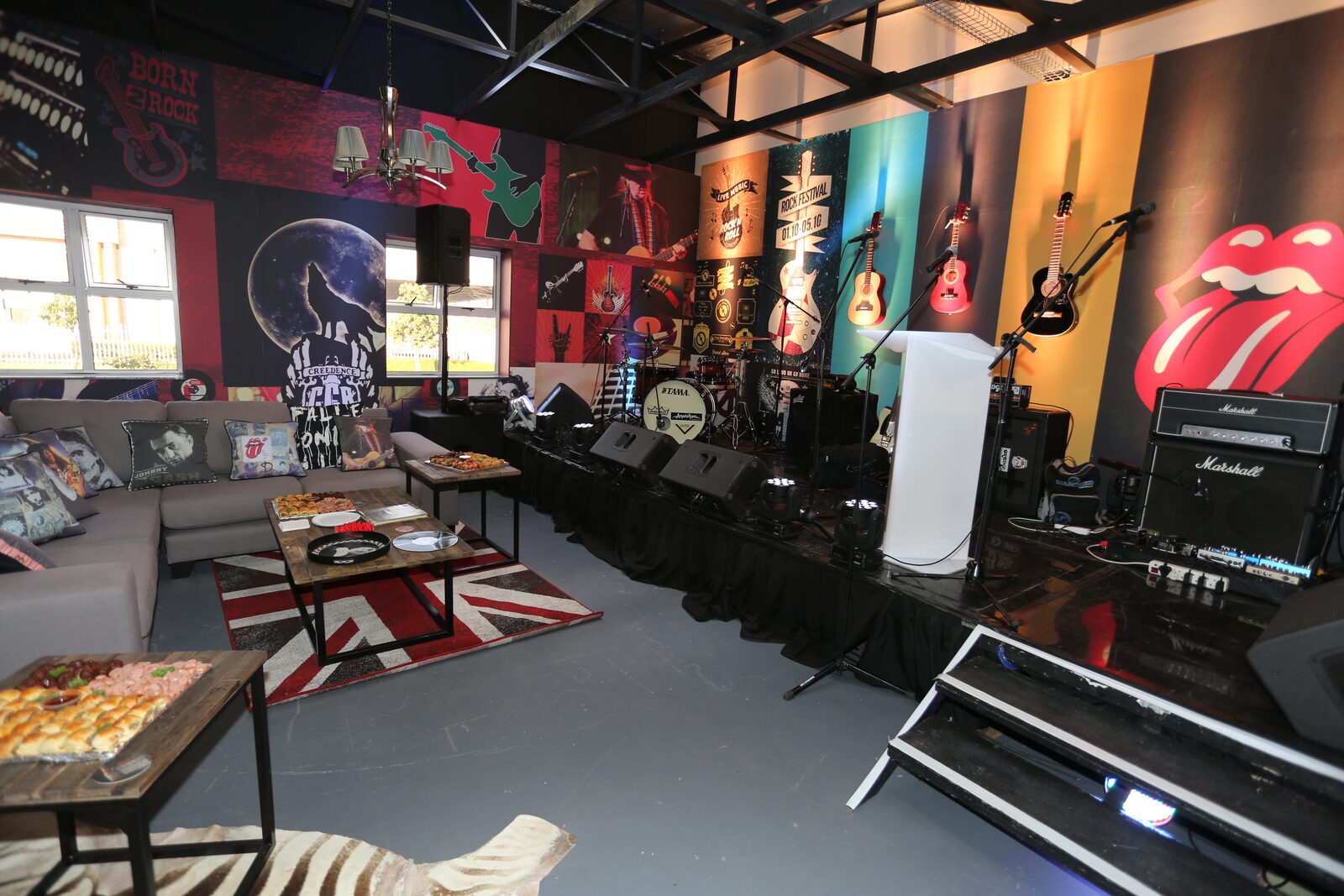 Rock-themed venue with Rolling Stones décor — wide angle