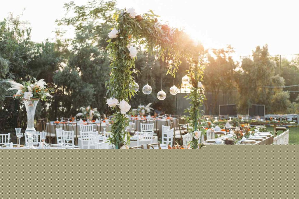 An outdoor wedding reception setup with tables and chairs available for decor hiring in Johannesburg.