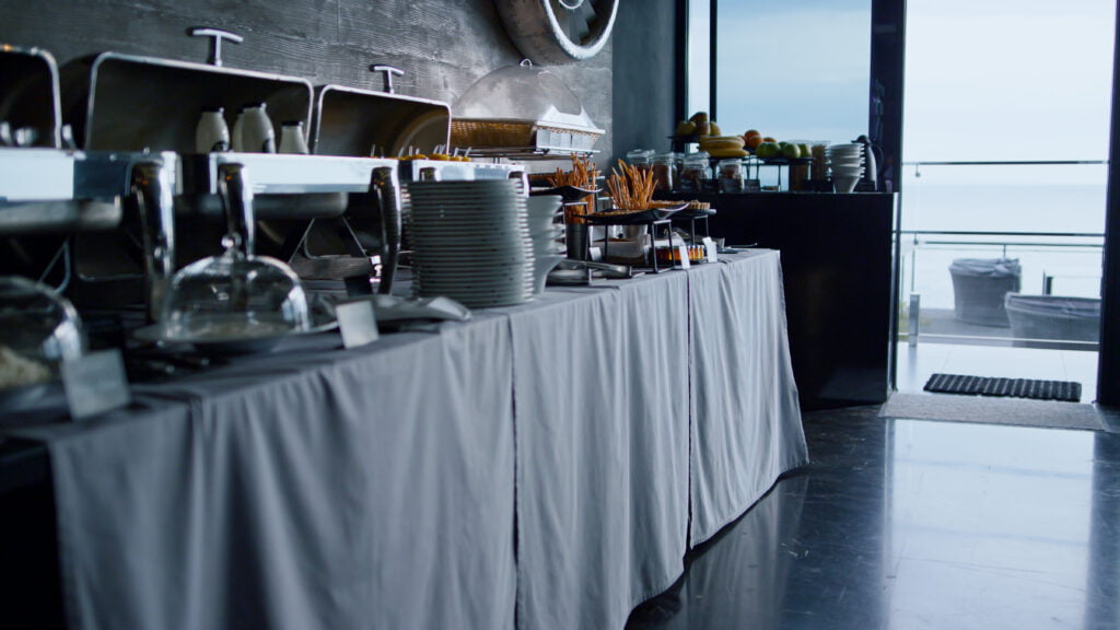 A table filled with delectable cuisine overlooking the serene ocean.