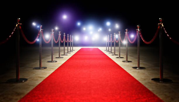 A red carpet with ropes in the background, available for hire.
