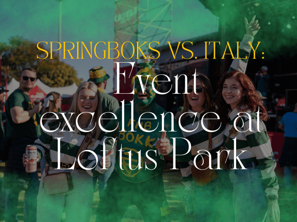 Four fans in green Springboks attire pose and smile at an outdoor event at Loftus Park, with a crowd and stage visible in the background before the exciting Springboks vs Italy rugby match.